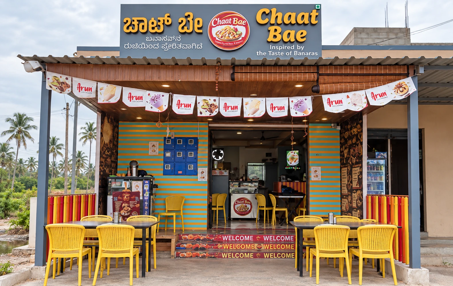 Chaat Bae Hoskote storefront with its English and Kannada sign, Banaras-inspired logo and outdoor seating